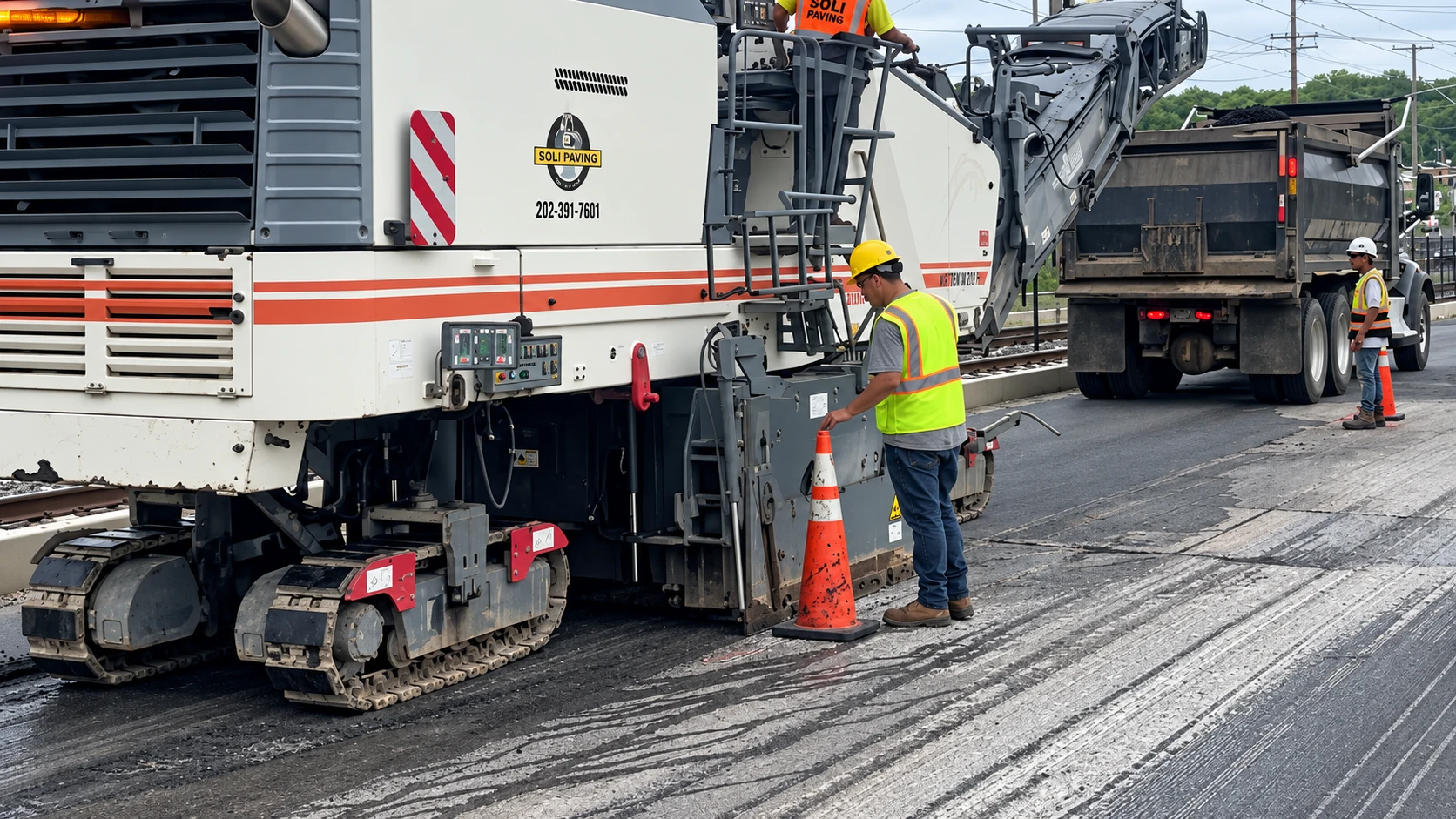 Milling equipment removing an existing concrete surface